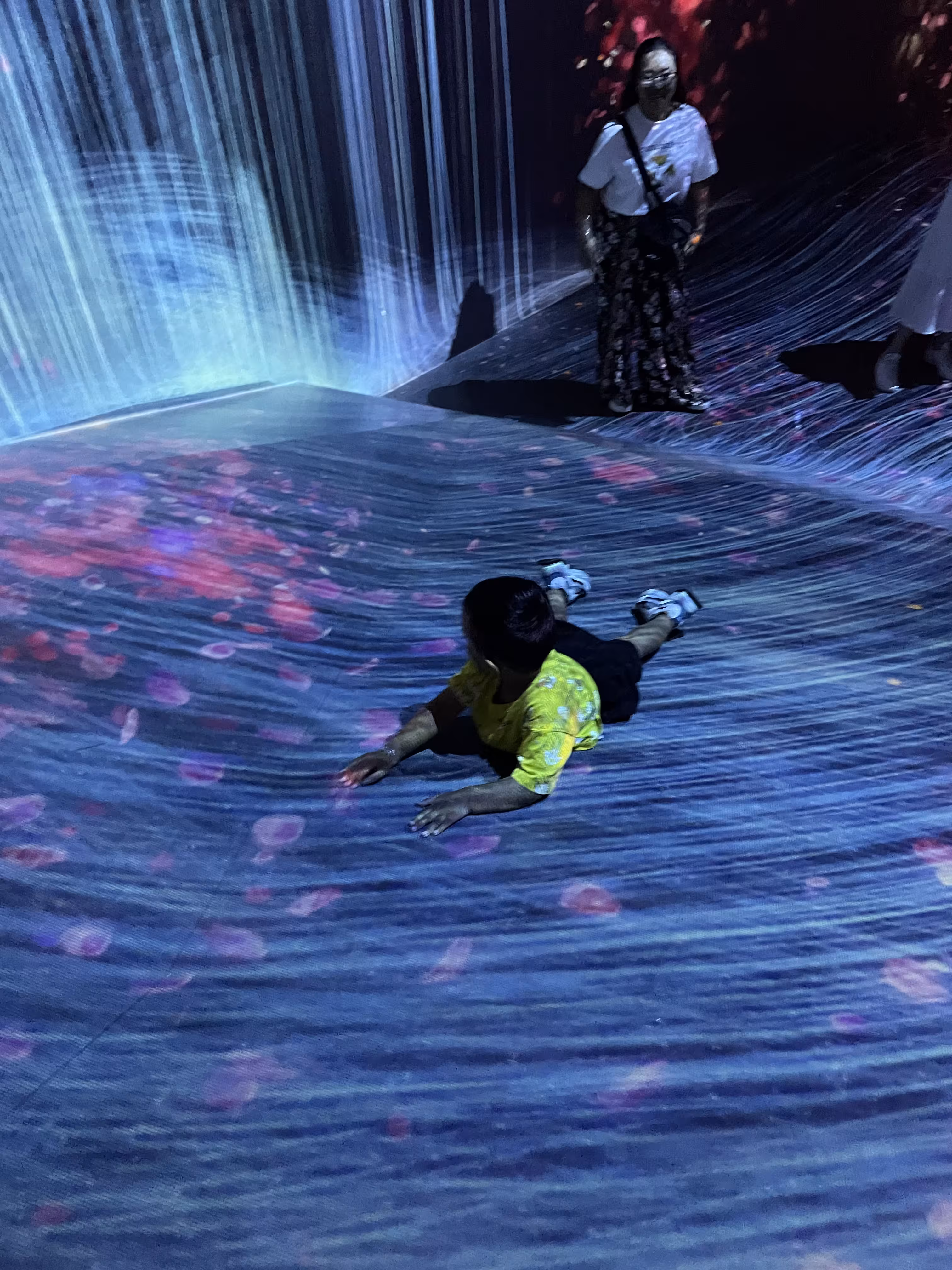 Having fun at TeamLabs Planets.